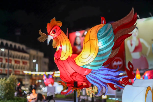 istock Chinese lantern colourful decorative chicken decoration around the Clock tower on a roundabout in old phuket town during the vegetarian festival phuket thailand. 1735503132