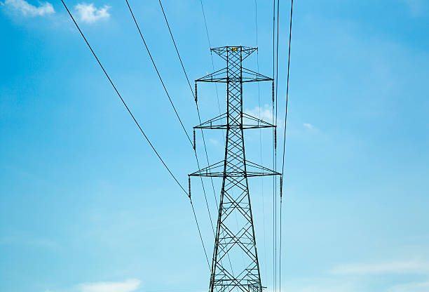 istock Long line of electrical transmission towers carrying high volt 173550426