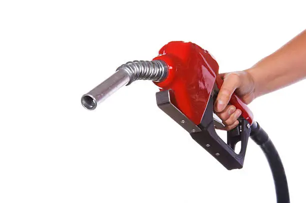 Hand holding a gasoline nozzle on a pure white background.  (Focus is on the nozzle)Other Related Pictures in my portfolio: