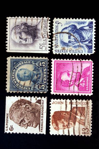 Former US Presidents "F.D.Roosevelt, T.Roosevelt, Washington, Lincoln, Kennedy on six old commemorative U.S. stamps." theodore roosevelt us president stock pictures, royalty-free photos & images
