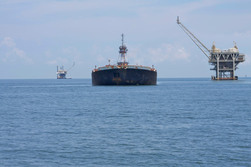 Oil cargo tanker and oil production platformAnother image: