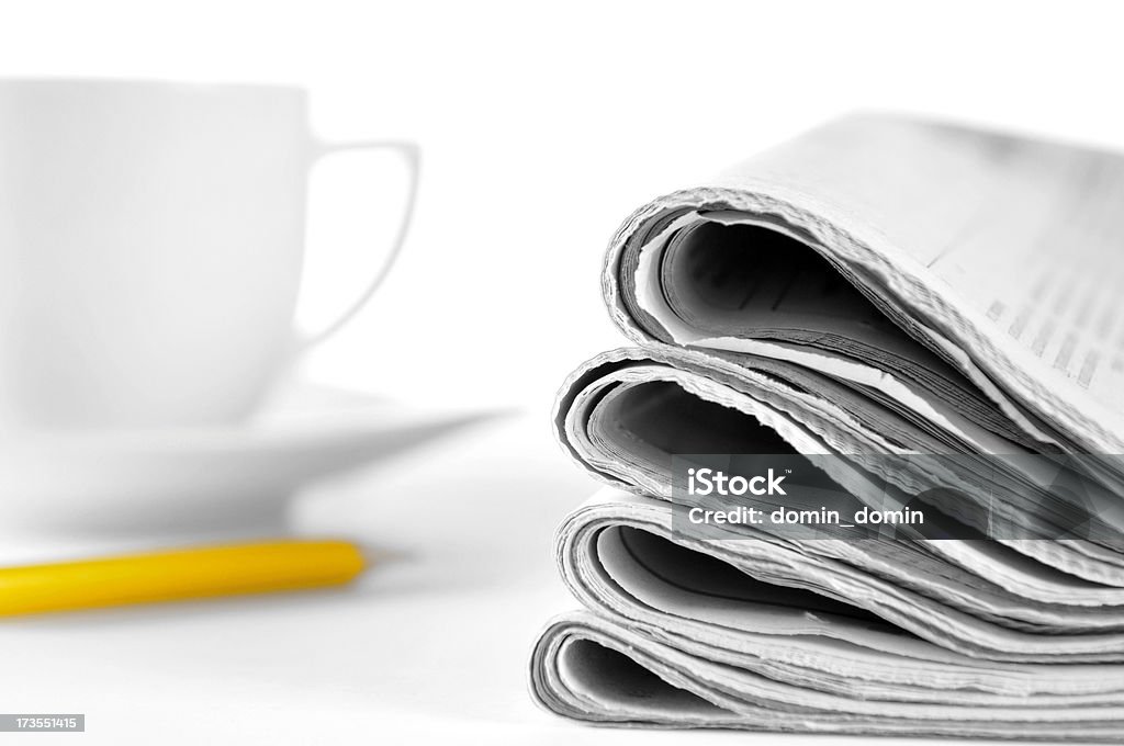 Morning news! Stack of newspapers, coffe cup, pencil on table "Morning news! Stack of newspapers, cup of coffee, yellow pencil, lying on white table." Article Stock Photo