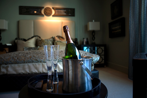 Champagne and glasses in master suite