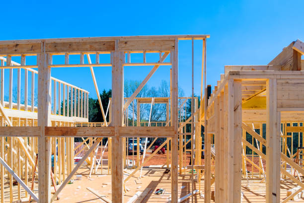 istock Wooden framing beams in an unfinished house construction work in progress view 1735521984