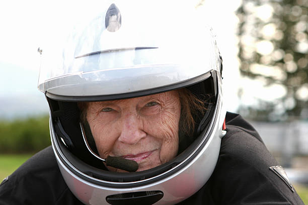 Cтоковое фото Бабушка с мотоцикл шлем