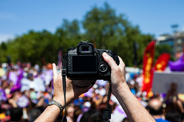 istock taking photos of crowds 173552577