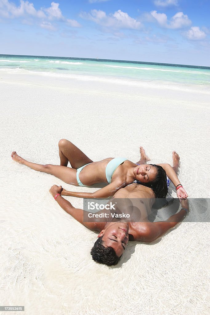 Tropical Dreams 02 This is a picture of a young couple on the beach. Hahahah I just checked my downloads and it turns out this imageaas 4th download is my 4444 sold image. Cool (Aug/28/05) Adult Stock Photo