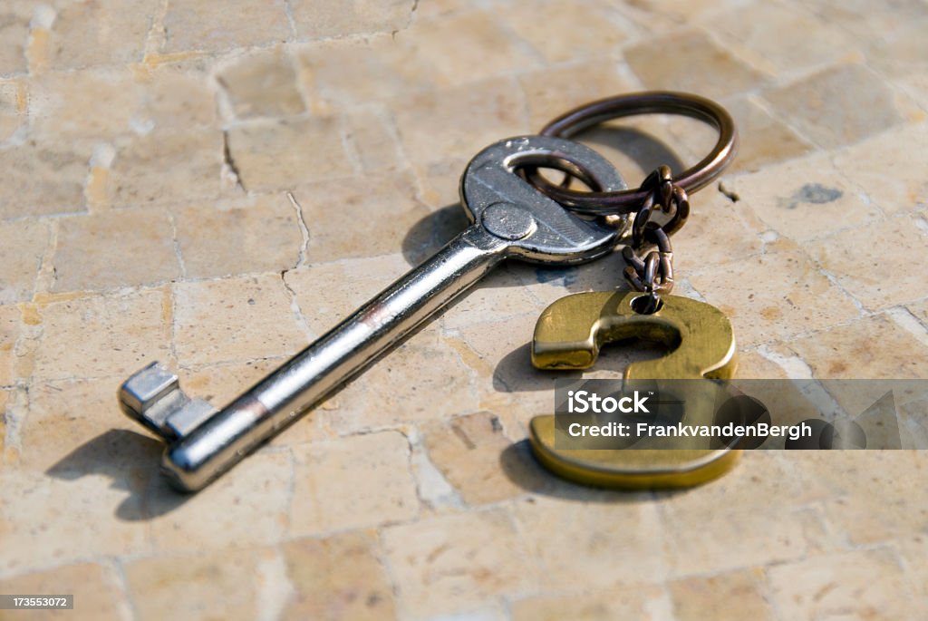 Hotel key with No.3 label Old fashioned hotel key with number three 3 label on a mosaic tiled background. Bed and Breakfast Stock Photo