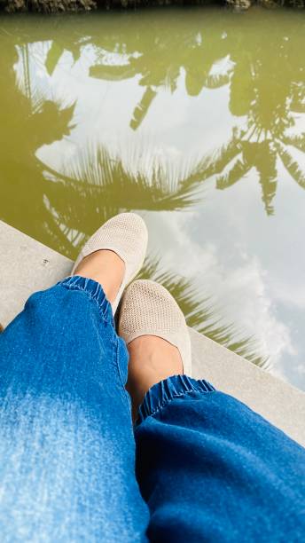 istock Sitting beside the water. 1735532543