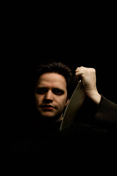 Killer Maniac with a knife. suspenseful stock pictures, royalty-free photos & images
