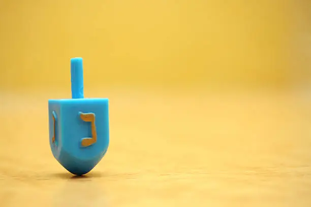 Hanukkah dreidel spinning in motion