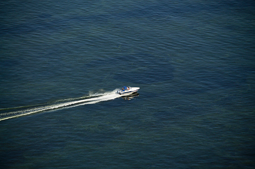Small fishing boat navigating in open sea Miami Florida