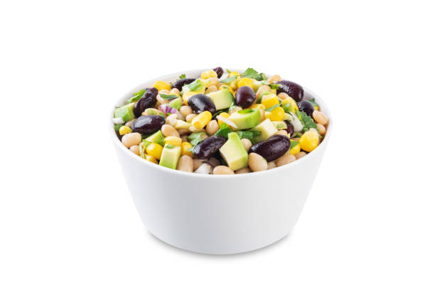 istock White beans kidney beans corn avocado salad in a bowl on a white isolated background 1735555097