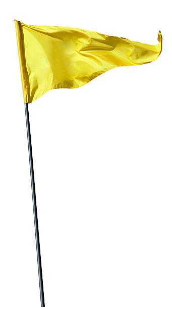 yellow flag にフラグ極吹く風に - ゴルフの旗 ストックフォトと画像