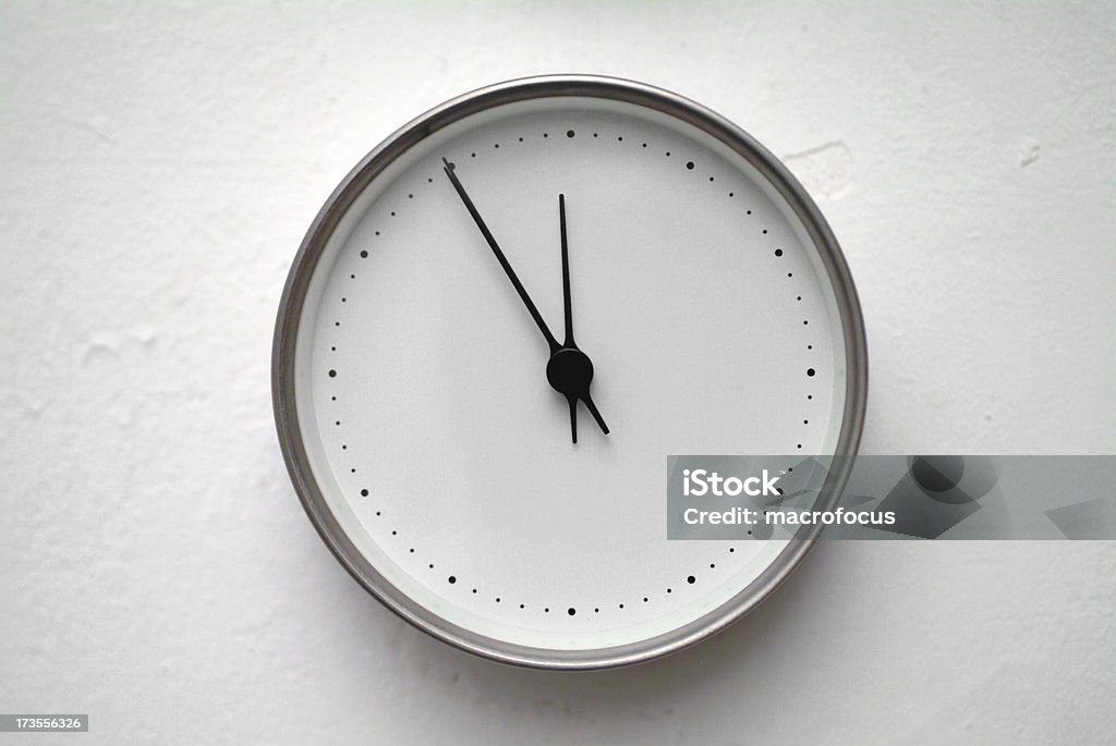 Wall clock at 5 to noon. Wall clock stopped at 5 to 12. 12 O'Clock Stock Photo