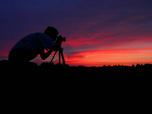 istock Silhouette of a photographer at the sunset 173556482