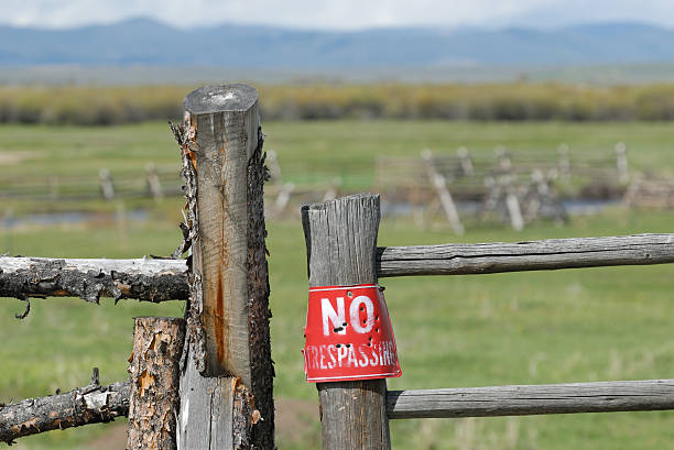 No Trespassing Sign on Gate stock photo