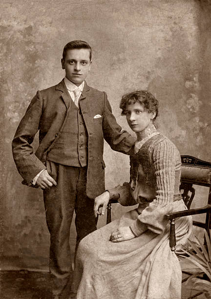 Man & Wife Wedding day portrait of a victorian man and his wife. wedding photos stock pictures, royalty-free photos & images