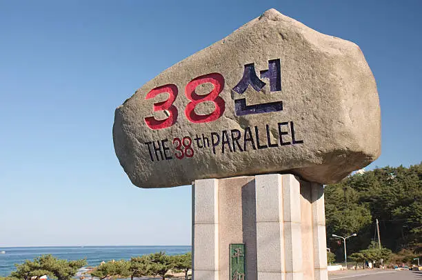 "A sign marking the 38th parallel line in northeastern South Korea's Gangwon-Do province. The Korean text translates as Three Eight Line. In most of South Korea, the 38th parallel line is near the military demarcation line that was established at the end of the Korean War as the border between North and South Korea."