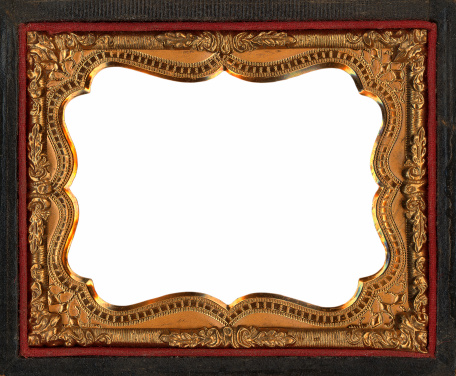 antique golden frame from a folding pocket sized photograph/Daguerrotype holder with canvas surround metal is probably tin