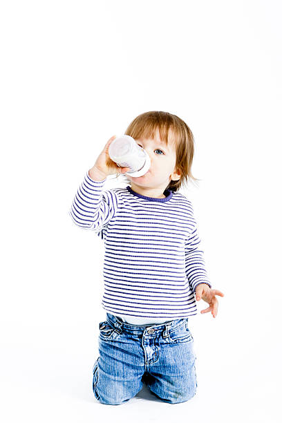 Baby drinking milk with bottle.Others photographs of this baby in this lightbox:
