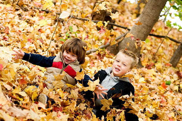 istock Kids in the Leaves 173558827