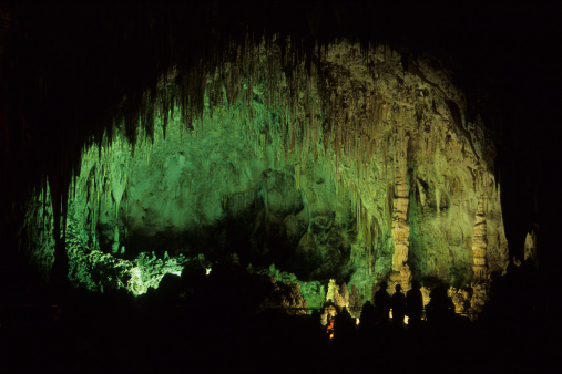 Silhouetted visitors enjoy Carlsbad Caverns National Park located in the Guadalupe Mountains in southeastern New Mexico.