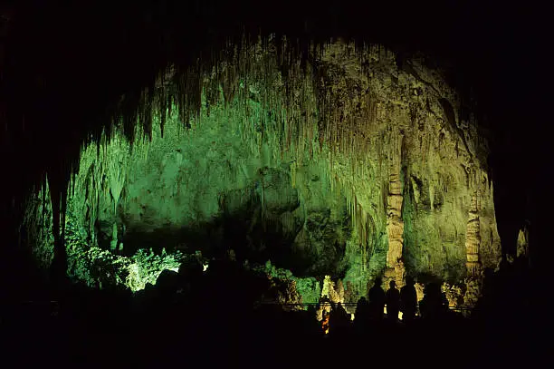 Silhouetted visitors enjoy Carlsbad Caverns National Park located in the Guadalupe Mountains in southeastern New Mexico.