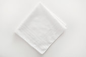istock White napkin cloth on white background 173559604