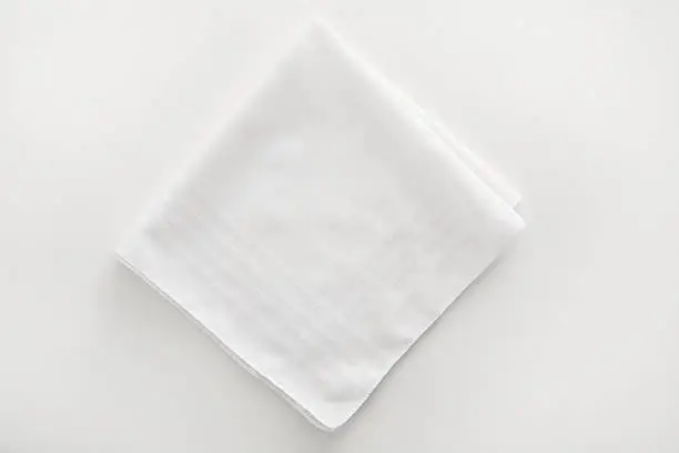 Photo of White napkin cloth on white background