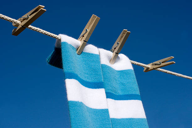 istock Striped Socks Hanging on Clothesline 173560416