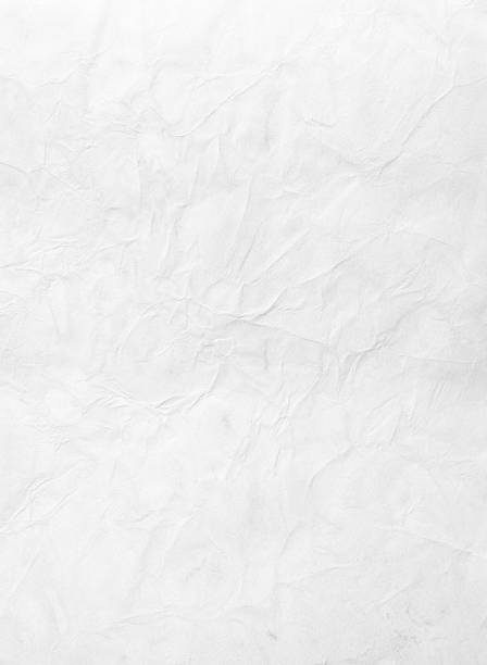 Wrinkled piece of paper against a white background stock photo