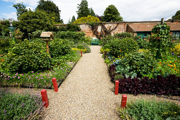 istock English Garden Path with Birdhouse 173560578