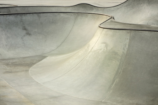 Lines and curves of a concrete surface skateboard and BMX bike park.  No graffiti.  Port Angeles, Washington, 2008.