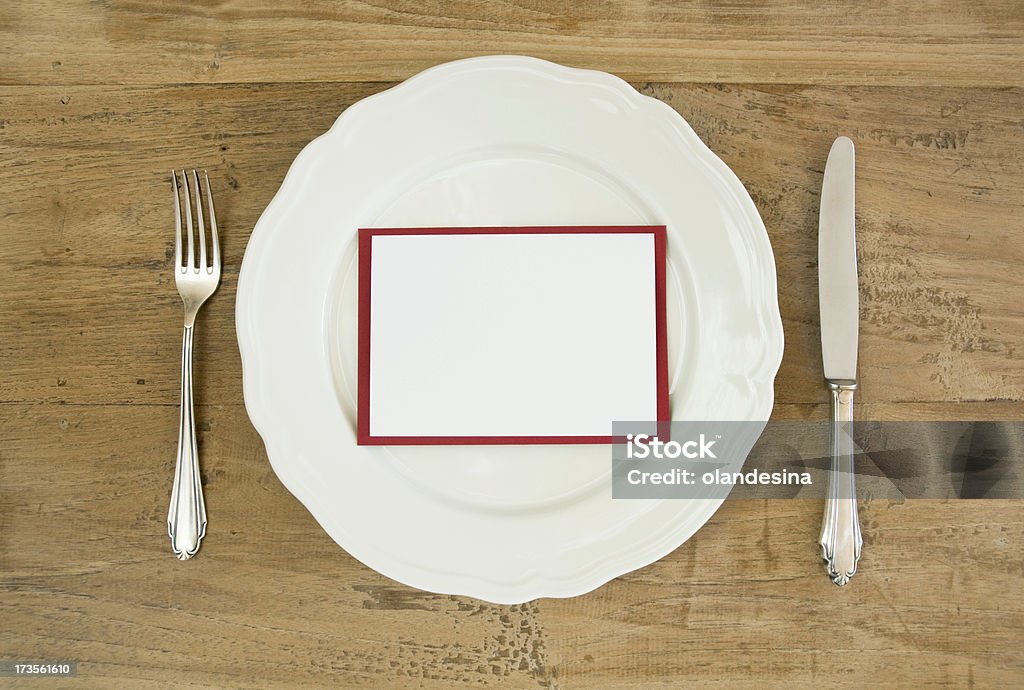 Plate with blank message card Add your message to the card. Backgrounds Stock Photo