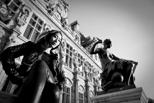 Paris fashion model in front of the hotel de ville (city hall of Paris)