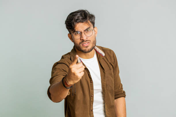 istock Irritated displeased aggressive unhappy Indian man gesturing hands blaming scolding failure problem 1735618677