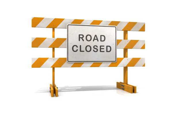 istock An orange and white road closed barricade sign 173561899