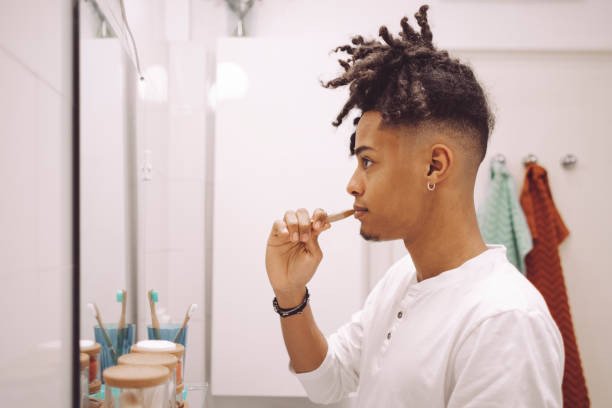 istock At home - young man brushing his teeth 1735627313