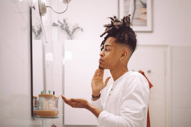 istock At home - young man brushing his teeth 1735627350