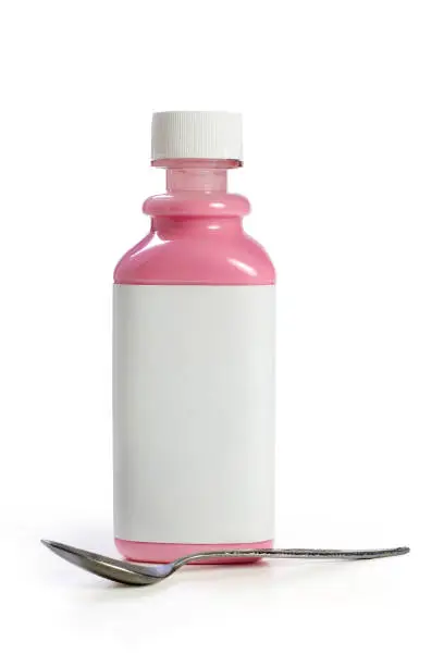 "Bottle of pink liquid antacid and spoon, isolated on whiteRelated images:"