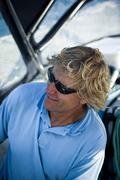 istock Retired man blonde hair sailing yacht relaxing 173563507