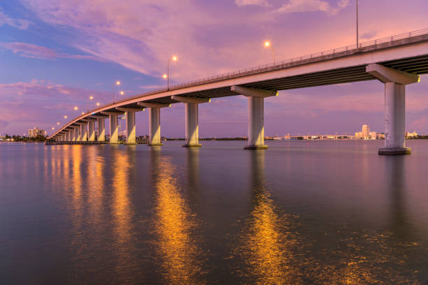 A panoramic dusk view of Sand Key Bridge, a girder bridge connecting Clearwater and Belleair Beach over the Clearwater Pass, Florida, USA.