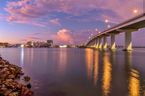 A calm Autumn evening view of waterfront of Clearwater Beach and Sand Key Bridge at Clearwater Pass, Florida, USA.