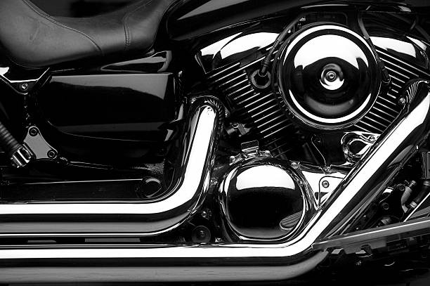 Motorcycle "A close-up on a V-Twin motorcycle engin with a lot of chrome.  High contrast, artistic rendering.  Selective focus.(not a Harley Davidson)." high contrast stock pictures, royalty-free photos & images
