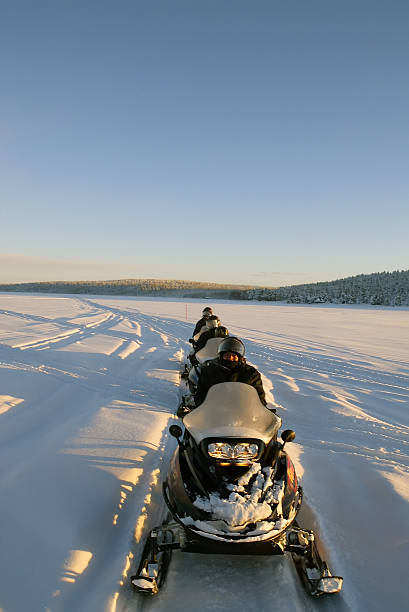 snowmobiles on tour winter finland - lapland "snowmobile, ski-doo expedition in lapland, finland, europe.7 people (photographer included) on the 7 day expedition tour through the ice cold finland winter. beautiful landscapes in this ice cold region. see my galleries for more pictures from this tour." Snowmobiling stock pictures, royalty-free photos & images