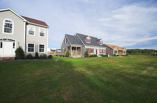 istock Three houses for sale on flat grassy lots 173564985