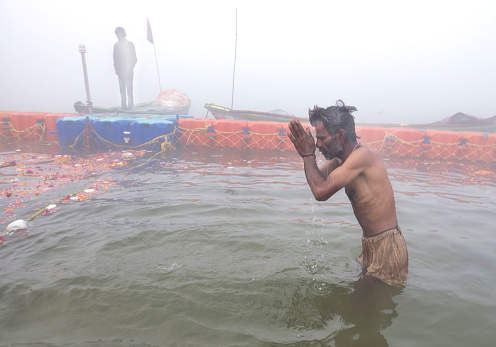Hallahabad. India- january 17 2019: The Prayag Kumbh Mela, also known as Allahabad Kumbh Mela is a mela, or religious gathering, associated with Hinduism and held in the city of Prayagraj, India, at the Triveni Sangam, the confluence of the Ganges, the Yamuna, and the mythical Sarasvati river.The festival is marked by a ritual dip in the waters, but it is also a celebration of community commerce with numerous fairs, education, religious discourses by saints, mass feedings of monks or the poor, and entertainment spectacle.Approximately 50 and 30 million people attended the Allahabad Ardh Kumbh Mela in 2019 and Maha Kumbh Mela in 2013 respectively to bathe in the holy river Ganges, making them the largest peaceful gathering events in the world.
