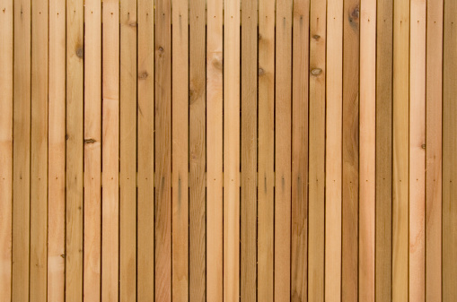 wooden fence made of unpainted boards, old territory fencing, close-up