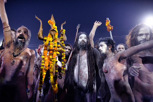 Hallahabad. India- january 15 2019: The Prayag Kumbh Mela, also known as Allahabad Kumbh Mela is a mela, or religious gathering, associated with Hinduism and held in the city of Prayagraj, India, at the Triveni Sangam, the confluence of the Ganges, the Yamuna, and the mythical Sarasvati river.[1] The festival is marked by a ritual dip in the waters, but it is also a celebration of community commerce with numerous fairs, education, religious discourses by saints, mass feedings of monks or the poor, and entertainment spectacle.[2][3] Approximately 50 and 30 million people attended the Allahabad Ardh Kumbh Mela in 2019 and Maha Kumbh Mela in 2013 respectively to bathe in the holy river Ganges, making them the largest peaceful gathering events in the world.[4][5]